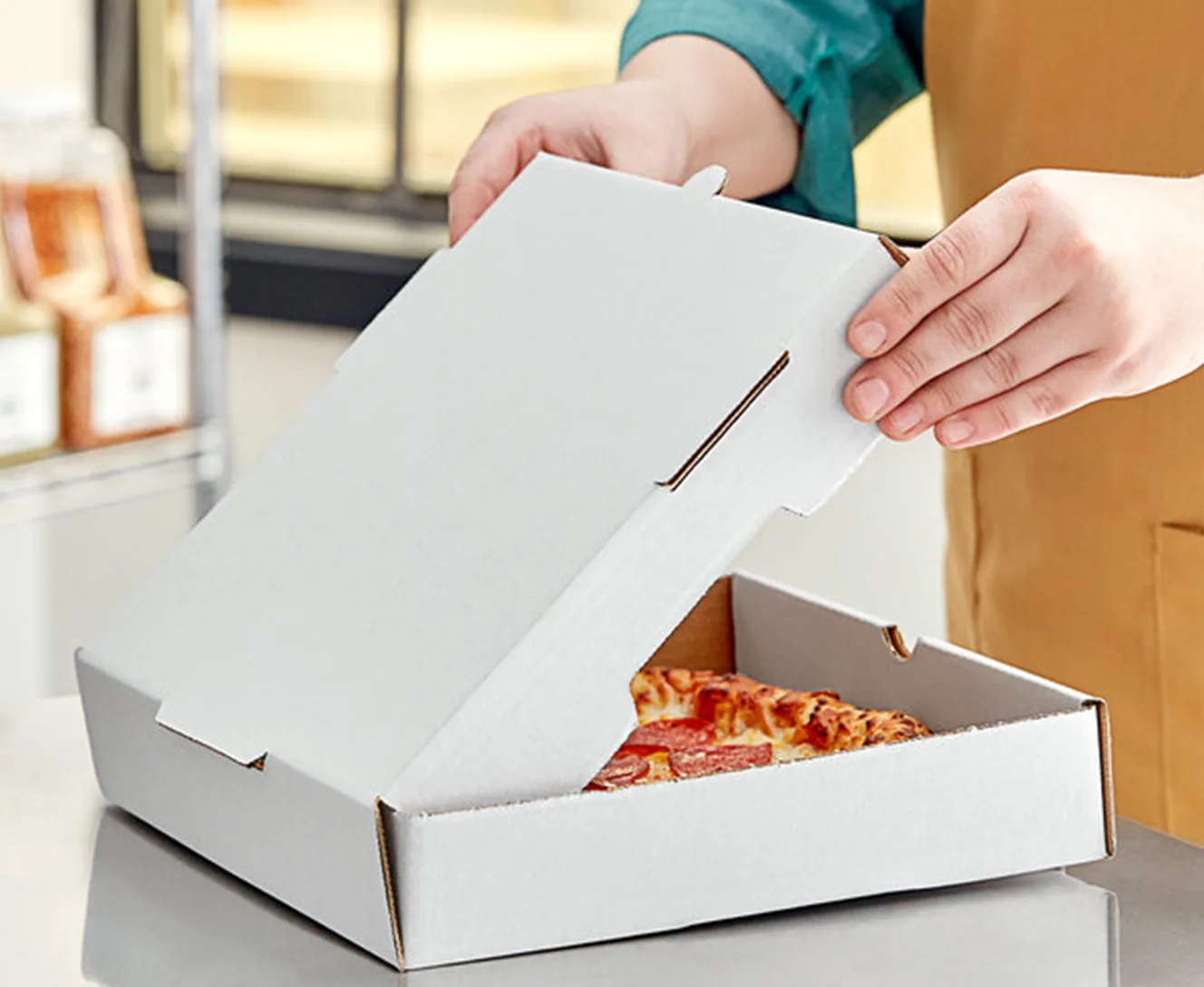 El material de la caja de pizza personalizada.